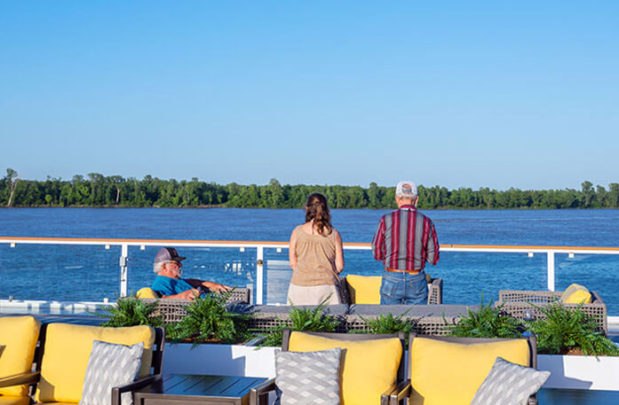 Passengers on deck viewing the passing scenery