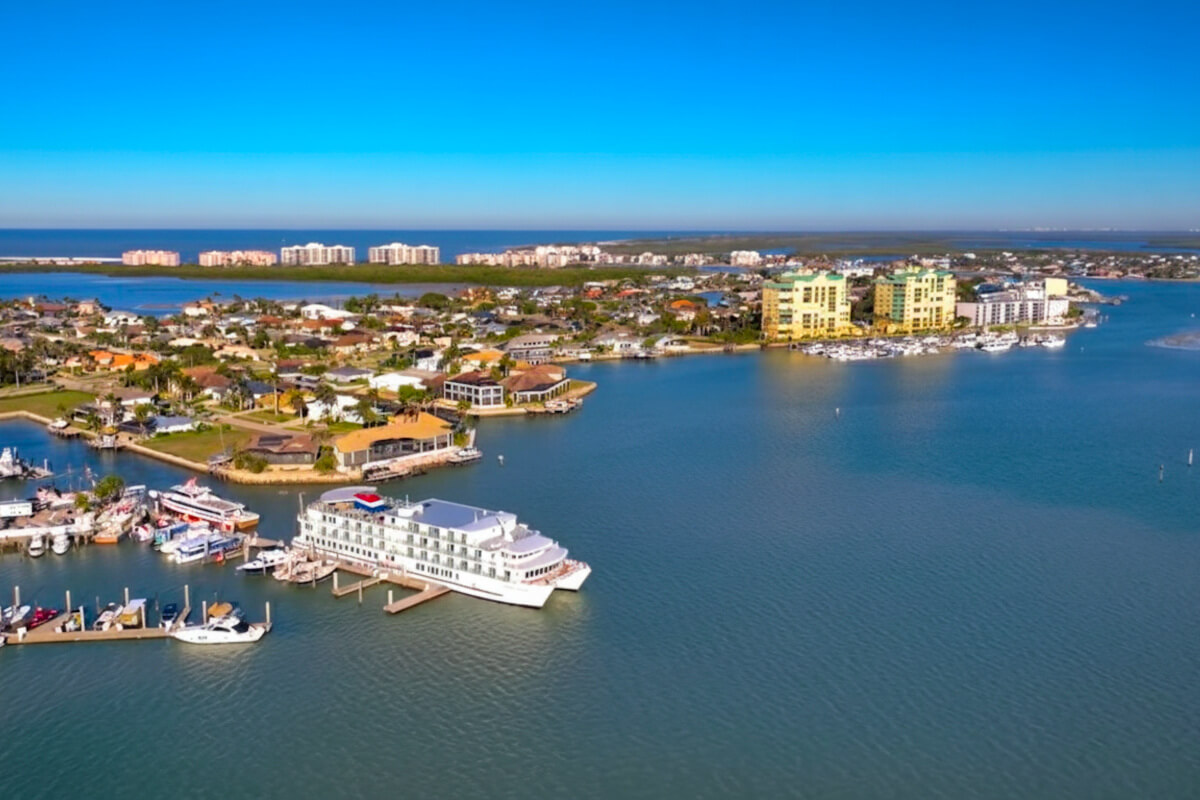 An American Cruise Lines ship, docked in a port along the Florida Keys