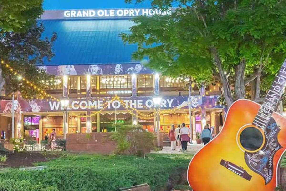 The Grand Ole Opry with a guitar in the foreground