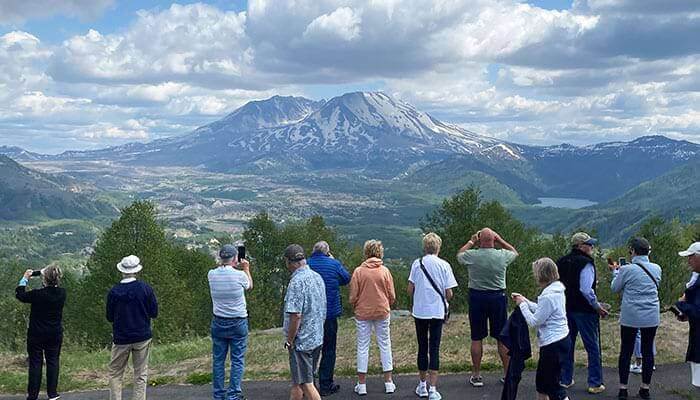 Cruise guests at an overlook viewing Mt. St. Helens.