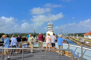 Passengers at the ship's bow, transiting the Gatun Locks, Panama Canal