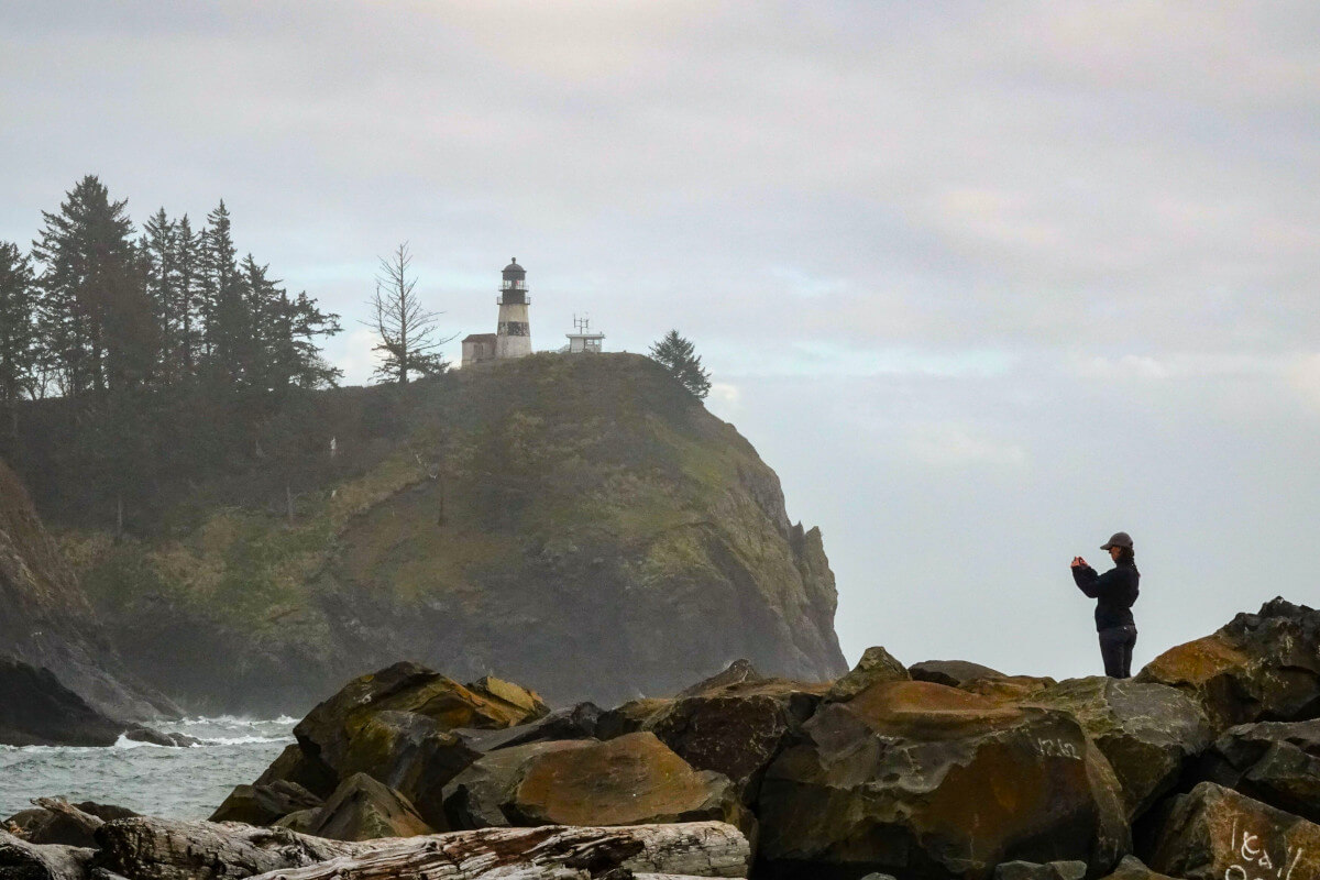 Coastline of Astoria, Washington, with lighthouse on a cliff