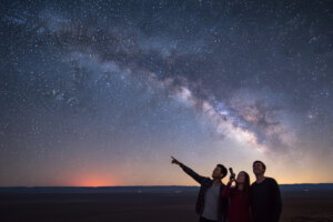 Cruise guests gazing at the sky filled with stars