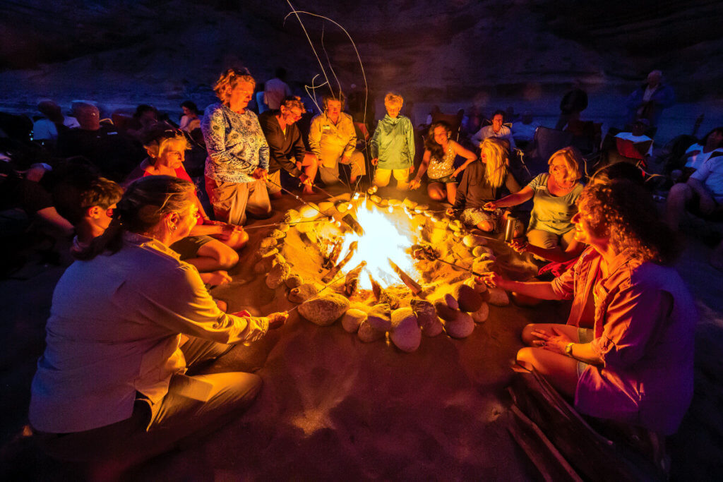 Roasting marshmallows by campfire, Punta Colorado, Isla San Jose, Baja California Sur, Mexico.