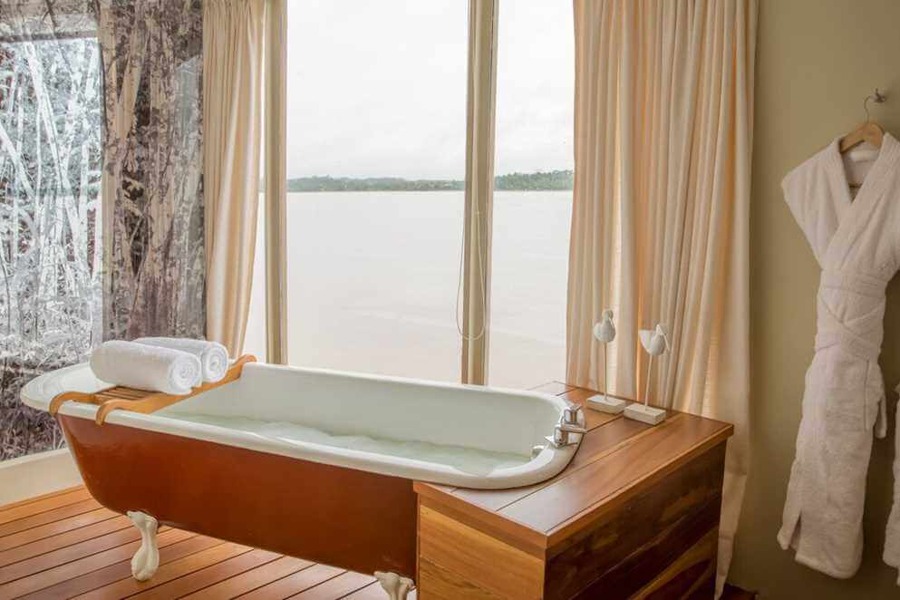 Bathtub in the bathroom of a category OS cabin aboard Delfin III