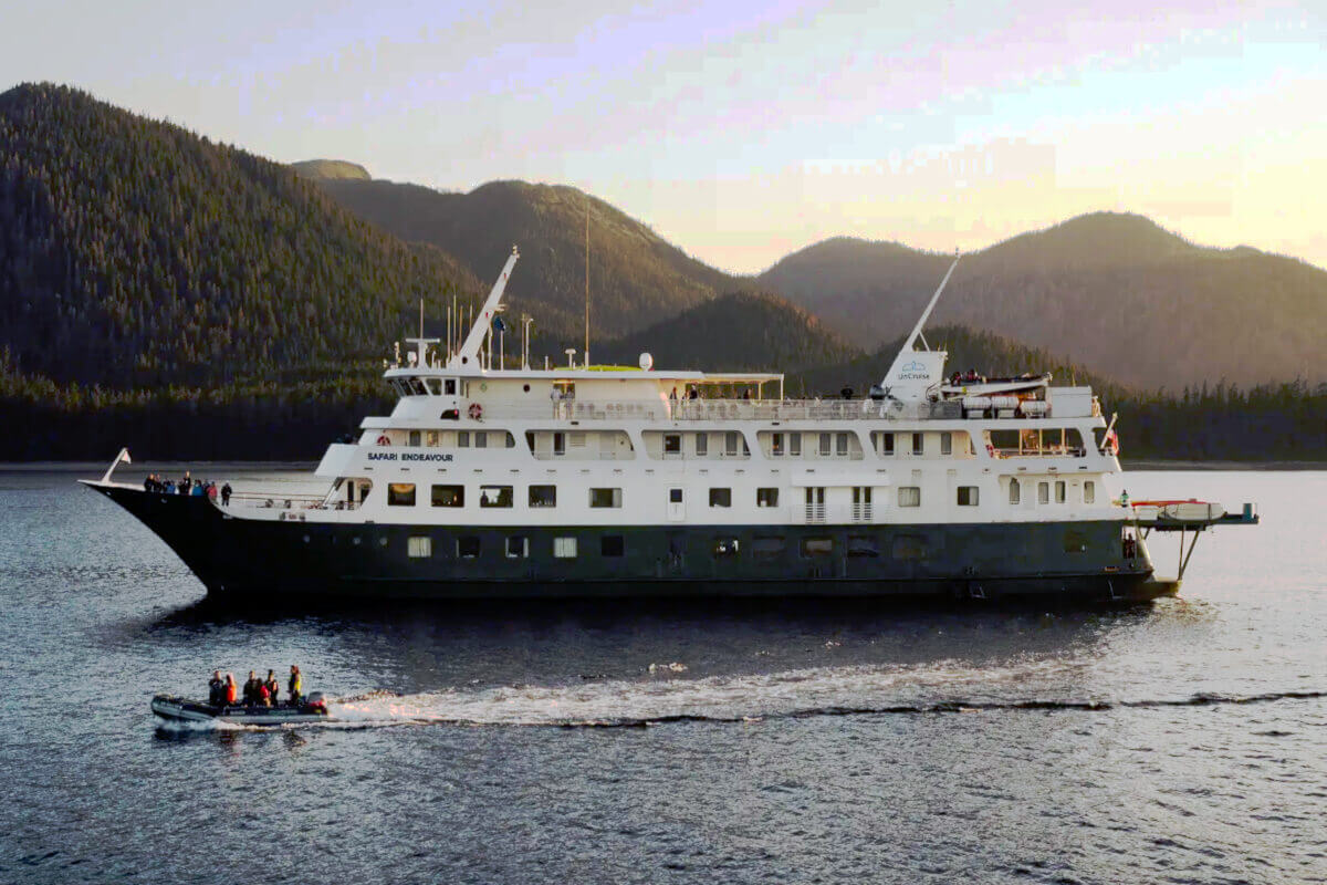 A skiff with cruise guests sails along side the Safari Endeavour