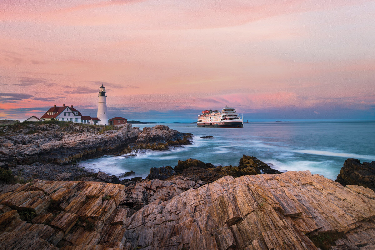 Victory ship sailing past the Portland Light