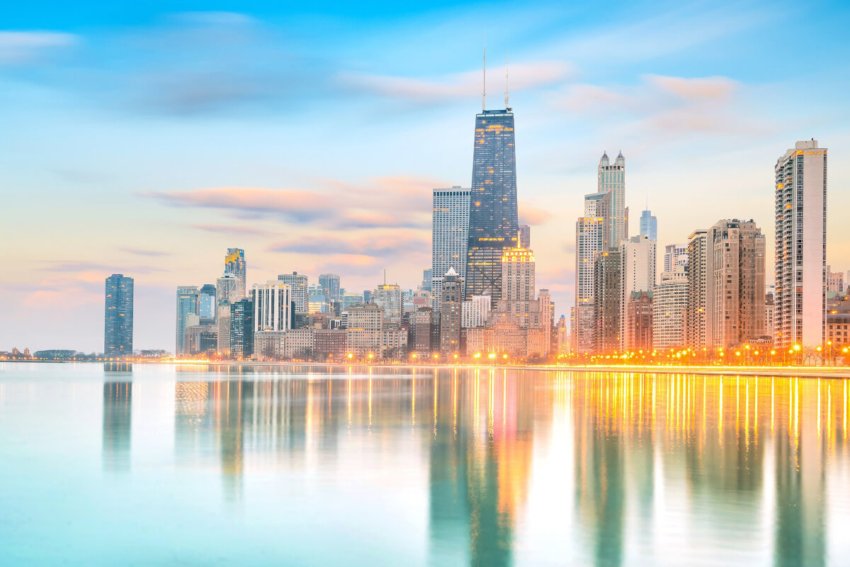 Skyline of Chicago, Illinois at sunrise, with the nighttime lights still on