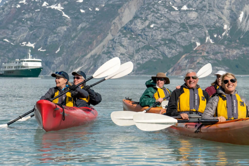 Guests kayaking in Alaska