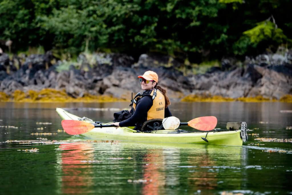 Kayaker exploring in Thomas Bay, Alaska